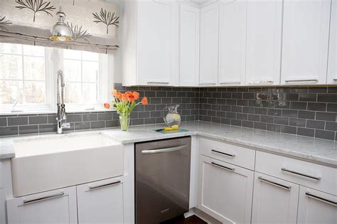A beadboard backsplash is easy to install and instantly brightens your kitchen. White Kitchen Cabinets with Gray Subway Tile Backsplash - Contemporary - Kitchen