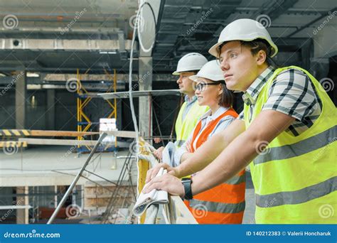 Team Of Builders Engineers Architects At Construction Site Copy