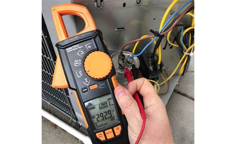 By using the ohmmeter setting mode of a multimeter. Testing the Run Capacitor While the System is Running ...