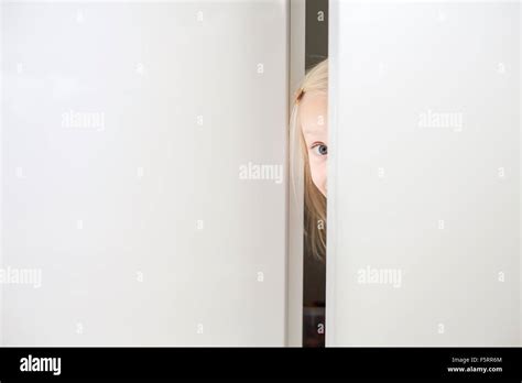 Sweden Vastergotland Lerum Girl 6 7 Looking Through Door Stock