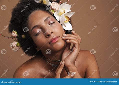 Portrait Of Half Naked African American Woman With Flowers In Her Hair