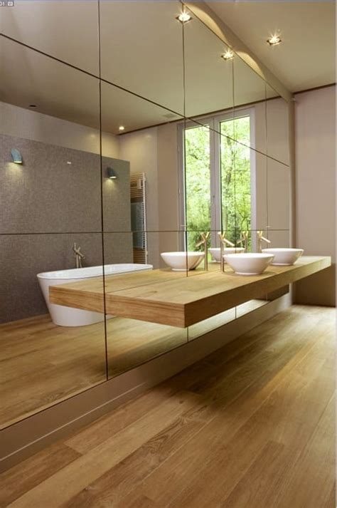 Both the frame and the wall behind this mirror glow in a really pleasant manner. Enhance Natural Light in Your Bathroom