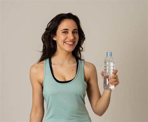 Healthy Attractive Sport Woman Holding And Drinking Water Bottle In