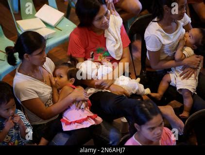 Filipino Mothers Breastfeed Their Babies During A Mass Breastfeeding