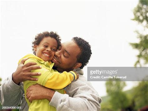 Black Dad Hugging Son Photos And Premium High Res Pictures Getty Images