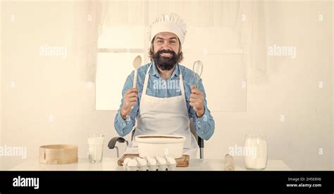 Confident Baker Mature Bearded Man Wear Chef Hat Male Cook Preparing Food In Home Kitchen