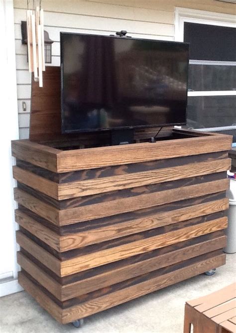 Not only does this keep your tv protected but it also prevents kids watching tv when they aren't meant to! Outdoor TV. Homemade custom TV cabinet with remote TV lift ...