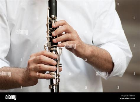 Hands Holding Clarinet Stock Photo Alamy