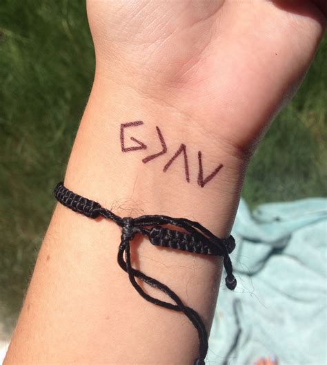 God Is Greater Than The Highs And Lows Simple Tattoo On Wrist With