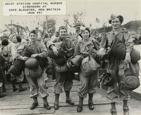 Four Nurses In Standard Issue Army Uniform Carry All Their Gear During
