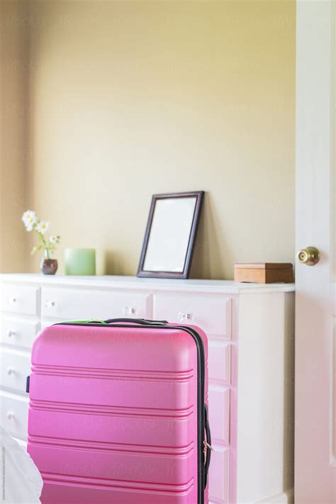 Packing Pink Suitcase For A Trip By Stocksy Contributor Skc Stocksy