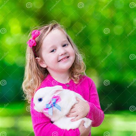 Little Girl Playing With Rabbit Stock Photo Image Of Beautiful Child