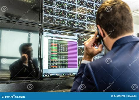 Stock Broker Trading Online Talking On Mobile Phone Editorial Image