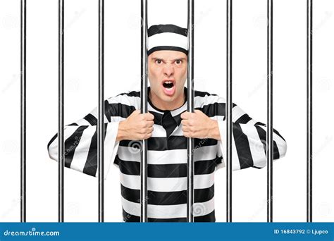 An Agitated Prisoner In Jail Holding Bars Stock Photo Image 16843792