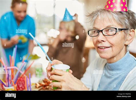 Senior Woman In Retirement Home Celebrates Birthday Together With