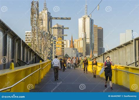 People Walking Across The Footbridge In Melbourne Editorial Photography