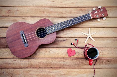 Cup Of Coffee With Ukulele On Old Wooden Background Stock Image Image