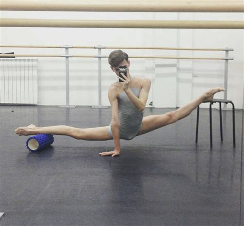 A Ballerina Is Talking On Her Cell Phone While Doing An Acrobatic Exercise