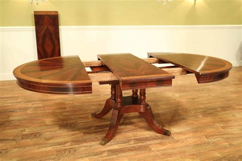 Traditional 54 Inch Round Mahogany Pedestal Table With Leaves