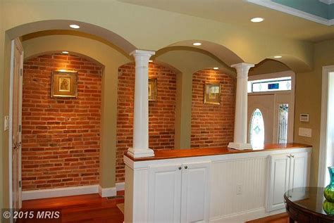 Traditional Hallway With Interior Brick And Columns In Baltimore Md