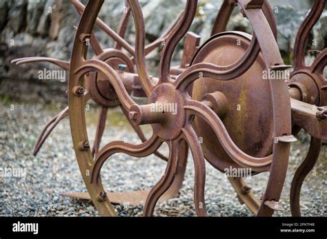 Metal Wheel On An Antique Farm Equipment Stock Photo Alamy