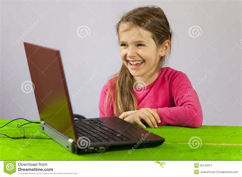 seven year old girl with laptop stock image 20142211