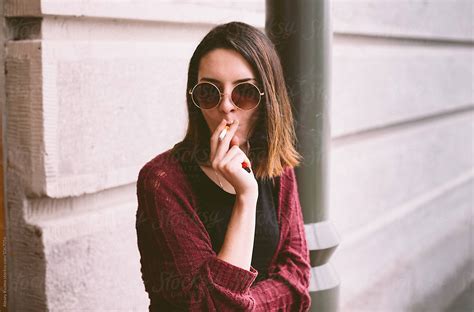 Portrait Of The Real Young Woman Smoking Del Colaborador De Stocksy