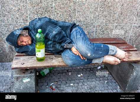 A Drunk Homeless Man On Street Lying On A Bench Wenceslas Square Stock Photo Alamy