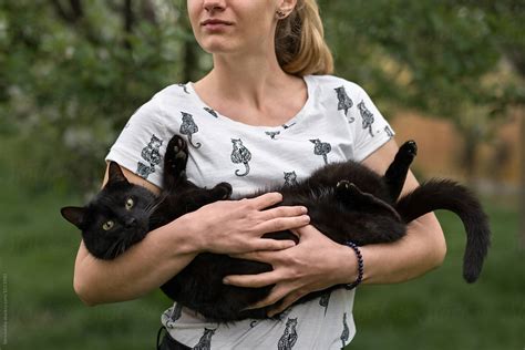 Woman Holding Her Black Cat By Stocksy Contributor Ibexmedia Stocksy