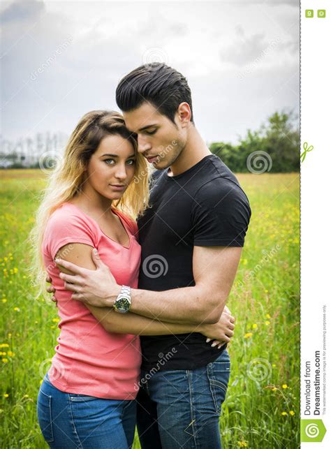 Boyfriend And Girlfriend Standing Showing Romantic Love Stock Photo