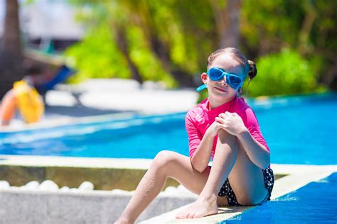 Girl Sitting On The Side Of A Swimming Pool 1739057 Stock Photo At Vecteezy