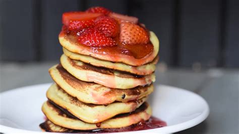 Covering Strawberry Pancakes With Dripping Stock Video
