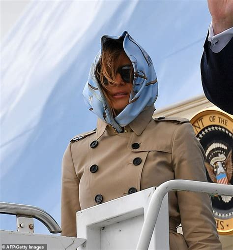 Melania Trump Struggles To Keep Her Headscarf In Place On A Very Windy