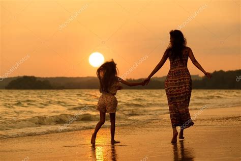 Mother And Daughter Running On The Beach Stock Photo By ©pat138241 48416927