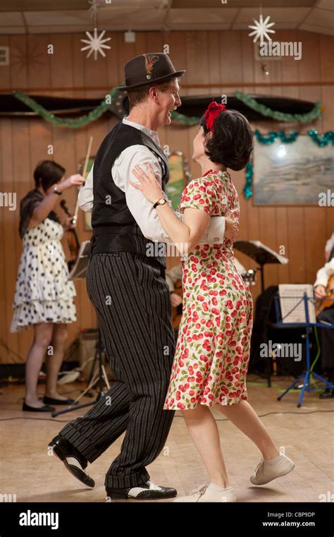 People A Couple Swing Dancing Lindy Hopping And Jiving To Retro 40s 50s Music At A Club Uk