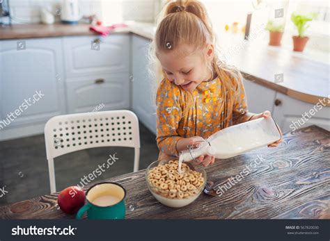Cute Little Girl Eating Cereal Milk Stock Photo Edit Now 567820030