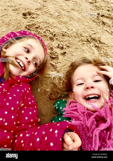 Girls Lying Beach Hi Res Stock Photography And Images Alamy