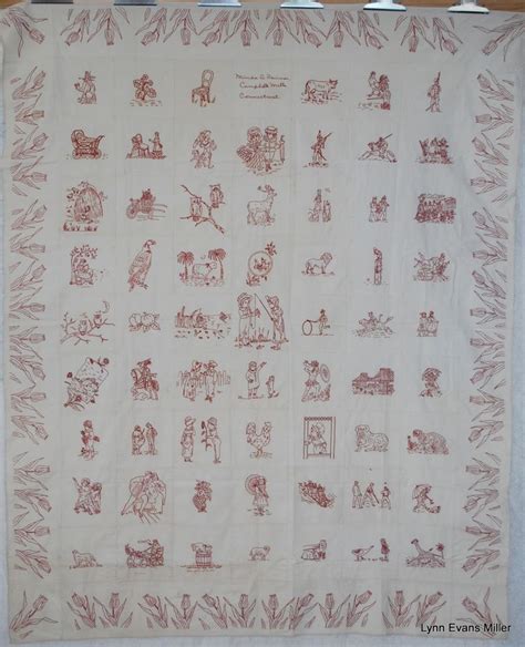 A White And Red Cloth With Various Images On The Front Including