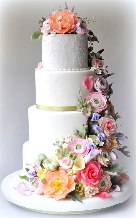 White Wedding Cake Cascading Flowers White Round 4 Tier Wedding Cake