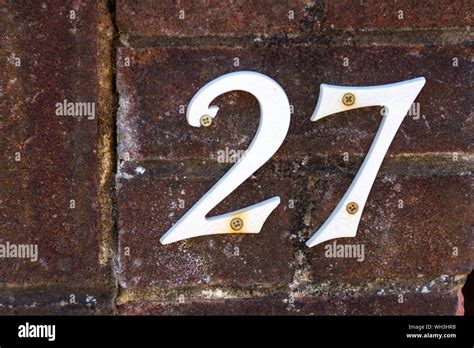White House Number 27 On An Old Brick Wall Stock Photo Alamy