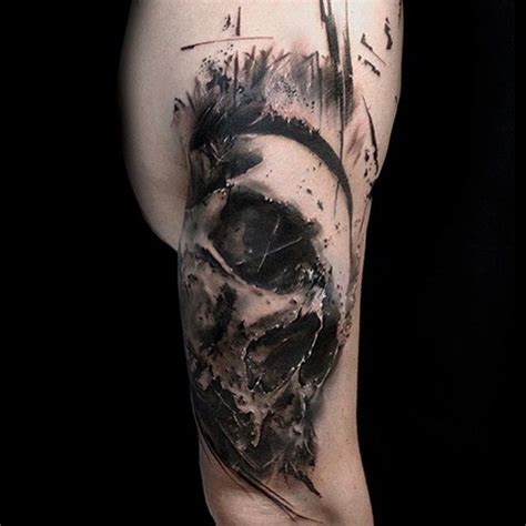 A Man S Leg With A Skull And Some Writing On The Back Of It