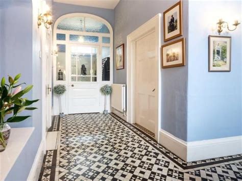 Georgian Entrance Hall With Black And White Floor Tiles And Blue Walls