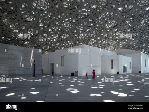 Visitors In The Light Rain Of The Louvre Abu Dhabi Architect Jean