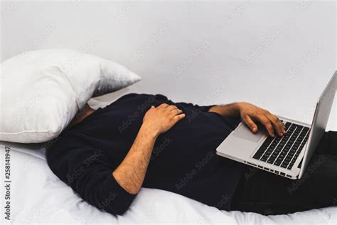 Man Sleeping While Working Laptop In Bed Tired Guy Falling Asleep While Working On A Laptop