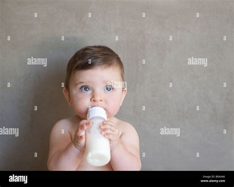 Baby Drinking Milk From A Bottle Stock Photo Alamy