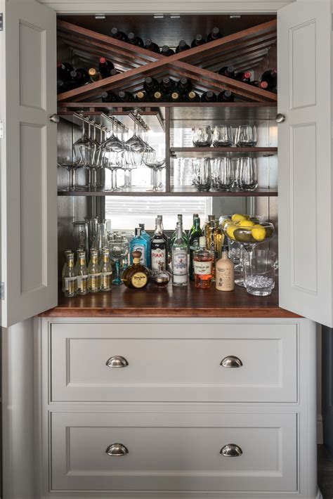 The two large handles have a mirrored finish for a glam element, and come together to create a circle on the front of this accent cabinet. Bespoke Drinks Cabinet - Wine Storage | Charlie Kingham ...