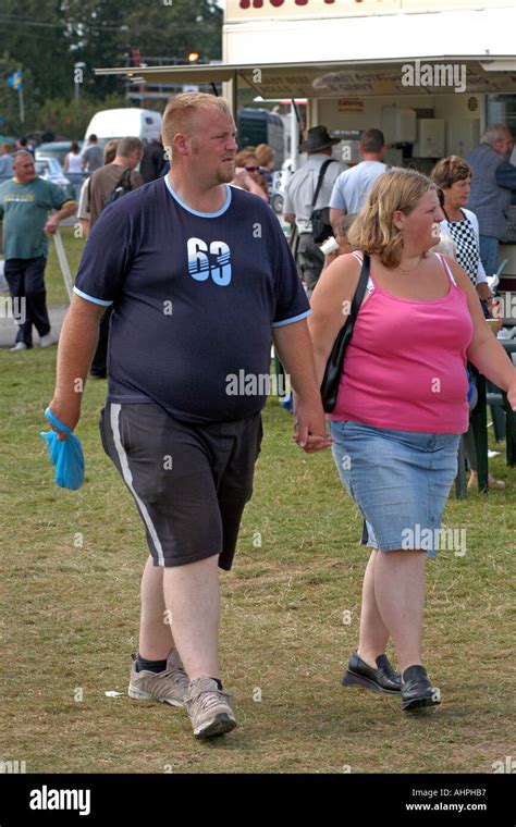 Two Fat People Walking Together Holding Hands Stock Photo 4741558 Alamy