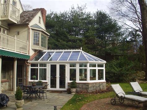 A Beautiful Conservatory Is Added To The Back Of This Home