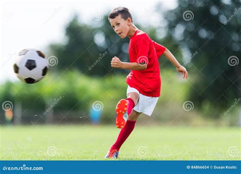 Boy Kicking Soccer Ball Stock Photo Image Of Outdoors 84866654