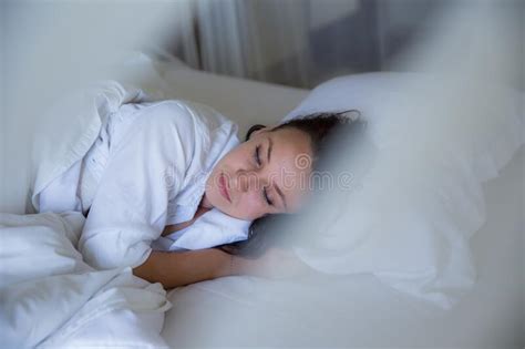 Beautiful Woman Sleeping In White Bed In The Morning Stock Photo